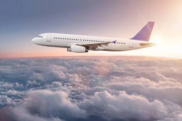 depositphotos_190396924-stock-photo-commercial-airplane-flying-above-clouds