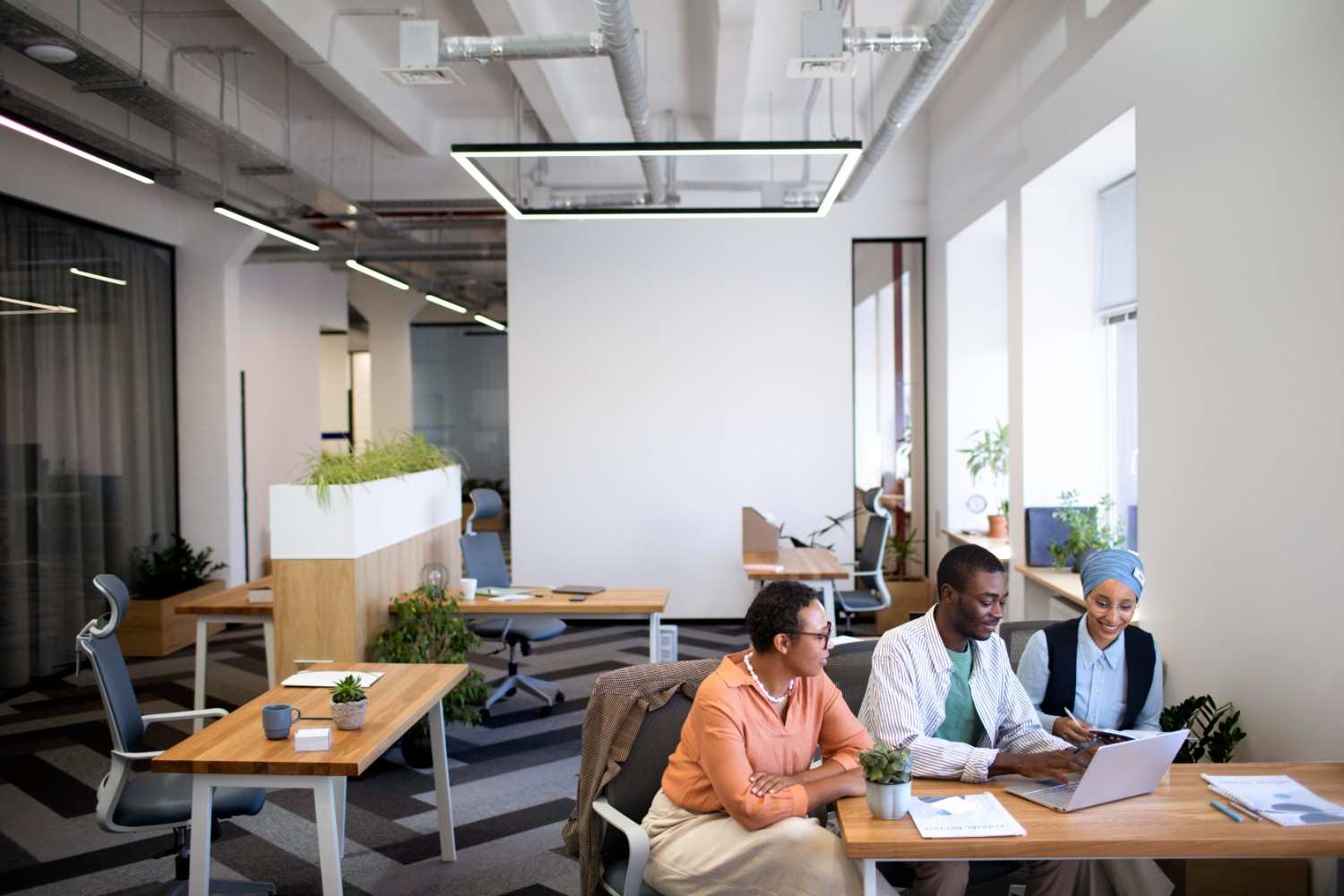 male-employee-getting-used-his-new-office-job-along-with-female-colleagues (1)