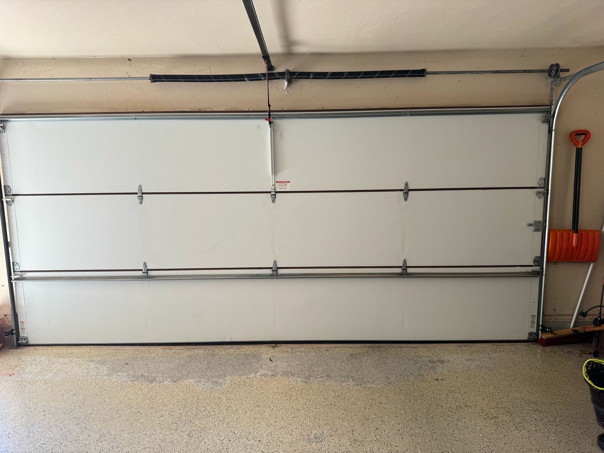 Why Garage Door Tracks Wear Unevenly on the Side Closest to the House