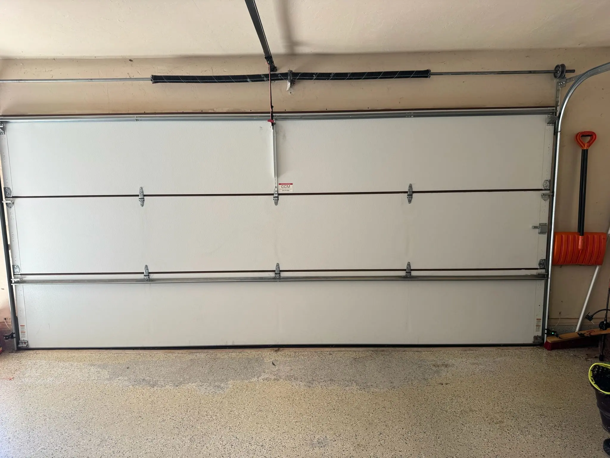 Why Garage Door Tracks Wear Unevenly on the Side Closest to the House
